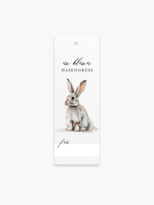 8 Geschenkanhänger mit Osterhasen-Motiv, Schriftzug „Ein kleiner Hasengruß“, Namenszeile, Lochung.